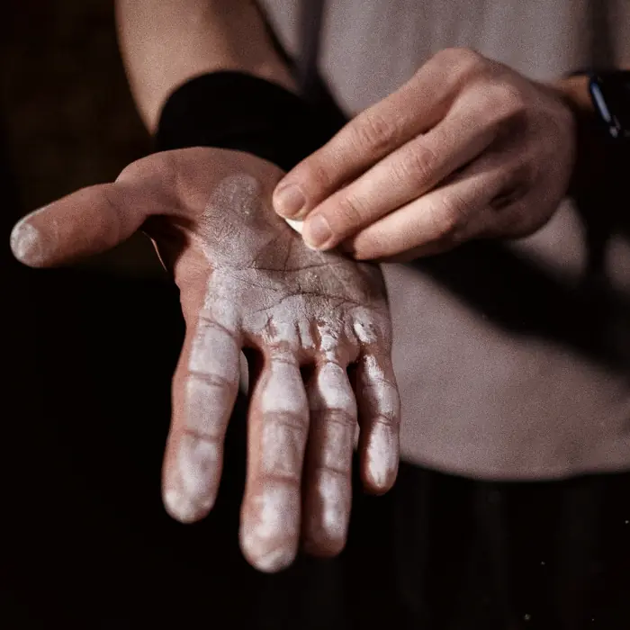 Chalked hand before a lift